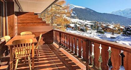 Living room with sofa-bed, one eating corner, a fire place, separated kitchen with dishwasher and Ne