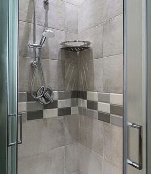 A shower area with a handheld showerhead and a wall-mounted showerhead, both with chrome finishes. - South Area Affittacamere (self check-in) Triple room with kitchen (Canicattì)
