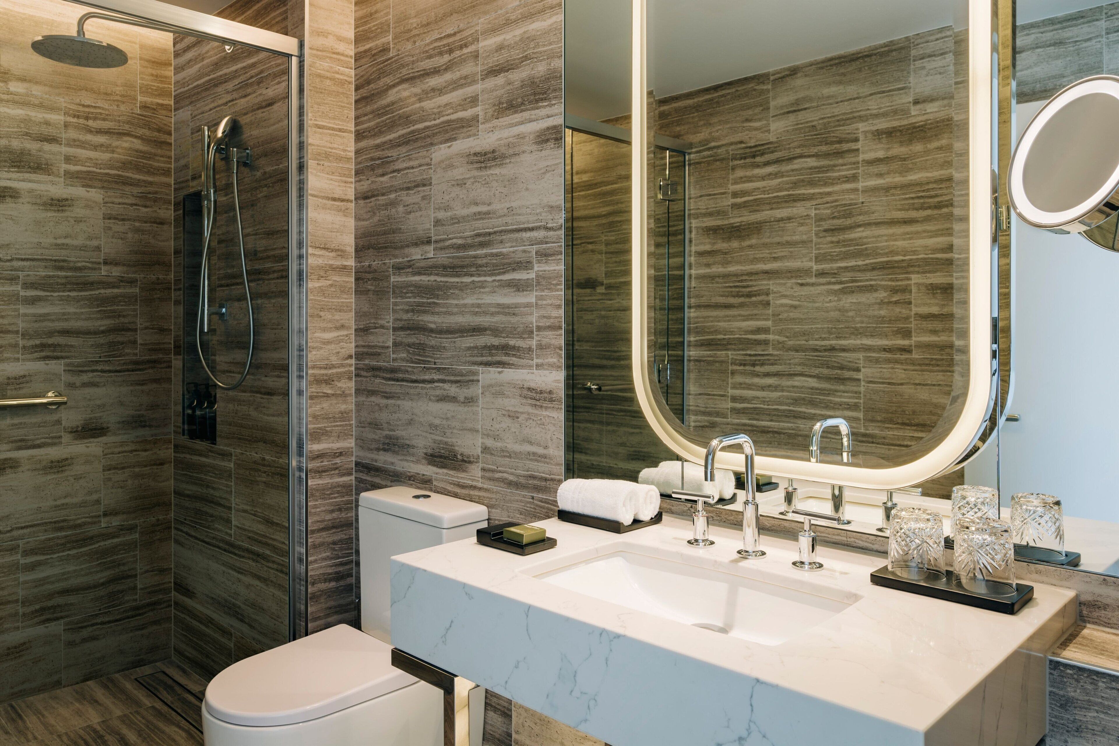 pavilion king room | bathroom | rainfall showerhead, designer toiletries, hair dryer, bathrobes