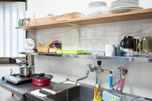 Fridge, microwave, stovetop, cookware/dishes/utensils