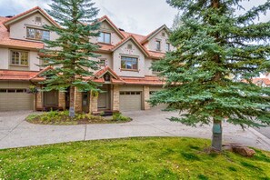 A two-story house with a garage, a front porch, and a well-maintained lawn. - Ideal Location- 3 BDR Mountain Village Townhome Steps from Skiing (Mountain Village)