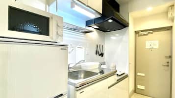 Fridge, microwave, stovetop, cookware/dishes/utensils