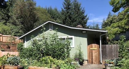 A waterfall, bountiful gardens and the sound of birds, fenced and pet friendly!