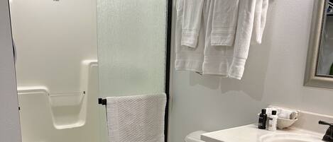 Shower, hair dryer, towels, soap