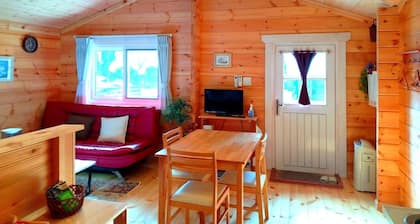 Chartered log house / Aso Kumamoto