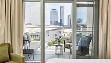 Suite, Multiple Beds, Balcony | In-room safe, desk, laptop workspace, blackout curtains