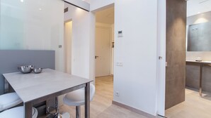 A modern kitchen with a light-colored countertop, two stainless steel bowls, and a sink. - Gaudí Views- Suite with view on Hospital Sant Pau (UNESCO Heritage)  - FREE WIFI (Barcelona)