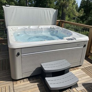 A hot tub with a cover, a control panel, and two step stools. - Tahoe Rim Retreat - Large 3BR + Bonus Rooms with Pool Table and Private Hot Tub - Pet Friendly! (Kings Beach)