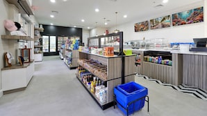 A clean, well-lit grocery store with organized shelves and a variety of products.