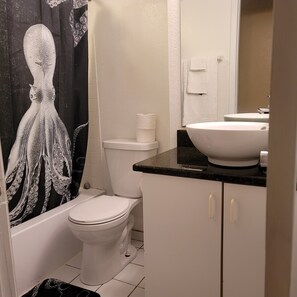 Combined shower/bathtub, hair dryer, towels, soap - Ocean View with Balcony and Heated Pool On The Beach! (Daytona Beach)