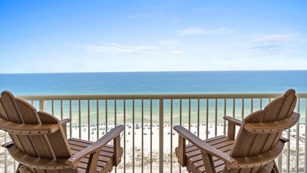 Two wooden Adirondack chairs facing a beach with a clear view of the ocean. - Beach Front Penthouse 4 Top Floor! K/K/K/K/tw/tw-Ocean Front 70 ft Balcony-Pools (Gulf Shores)
