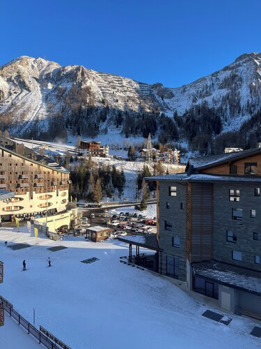 Panorama of Foppolo, the mountains and the slopes in the morning sun