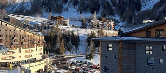 Panorama of Foppolo, the mountains and the slopes in the morning sun