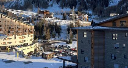 Panorama of Foppolo, the mountains and the slopes in the morning sun