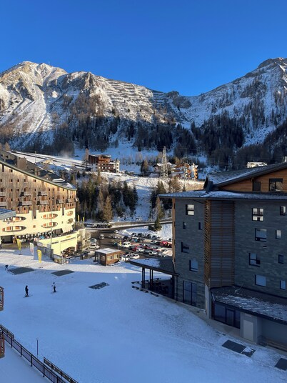 Panorama of Foppolo, the mountains and the slopes in the morning sun