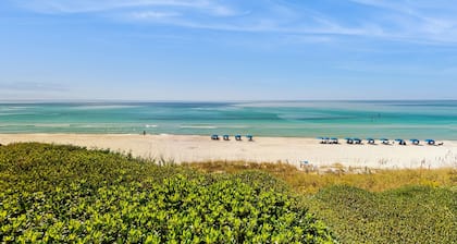 Ideally located beachfront home with balcony, washer/dryer, AC, & amazing views