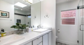 Shower, hair dryer, towels, shampoo