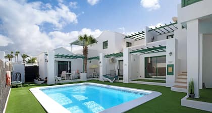 "Apt6 Las Palmeras III Lanzarote" with Sea and Mountain Views, Shared Pool & Private Terrace