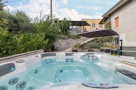 Outdoor spa tub. Casa Anna with Mountain View, Terrace, Whirlpool & Wi-Fi