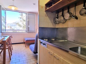 Enjoy cooking in the well-equipped kitchen with a stainless steel stove and ample storage for your essentials.
