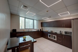 Enjoy cooking with ample counter space and a large window offering a city view.