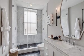 Bathtub, hair dryer, towels, soap