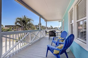 Private deck with 4-person dining table + 2 Adirondack chairs