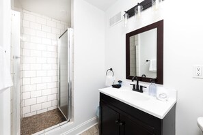 Bathtub, hair dryer, towels, soap