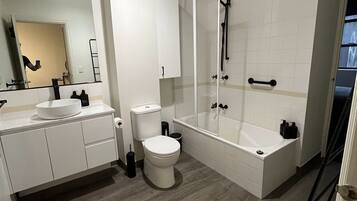 Combined shower/bathtub, hair dryer, towels, soap
