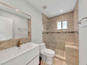 Shower, towels, soap, toilet paper
