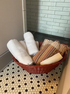 Shower, hair dryer, towels, shampoo