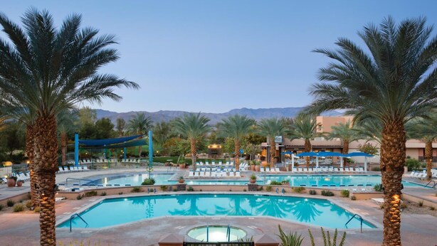 A resort pool area with multiple pools, palm trees, and lounge chairs. - Marriott Shadow Ridge I, X-Large One bedroom Villa with Fireplace, Kitchen, W/D (Palm Desert)