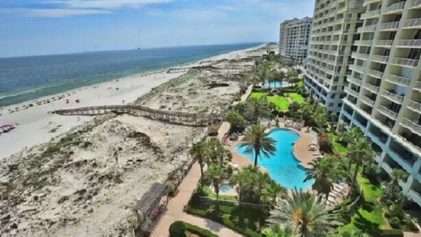 A beachfront hotel with a pool, beach access, and high-rise buildings. - Beach Club Avalon 306 Welcomes You! Low Floor! (Gulf Shores)