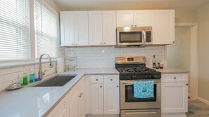 Microwave, coffee/tea maker, cookware/dishes/utensils