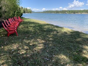 Relax by the serene lake with comfortable seating for social gatherings or solo relaxation.