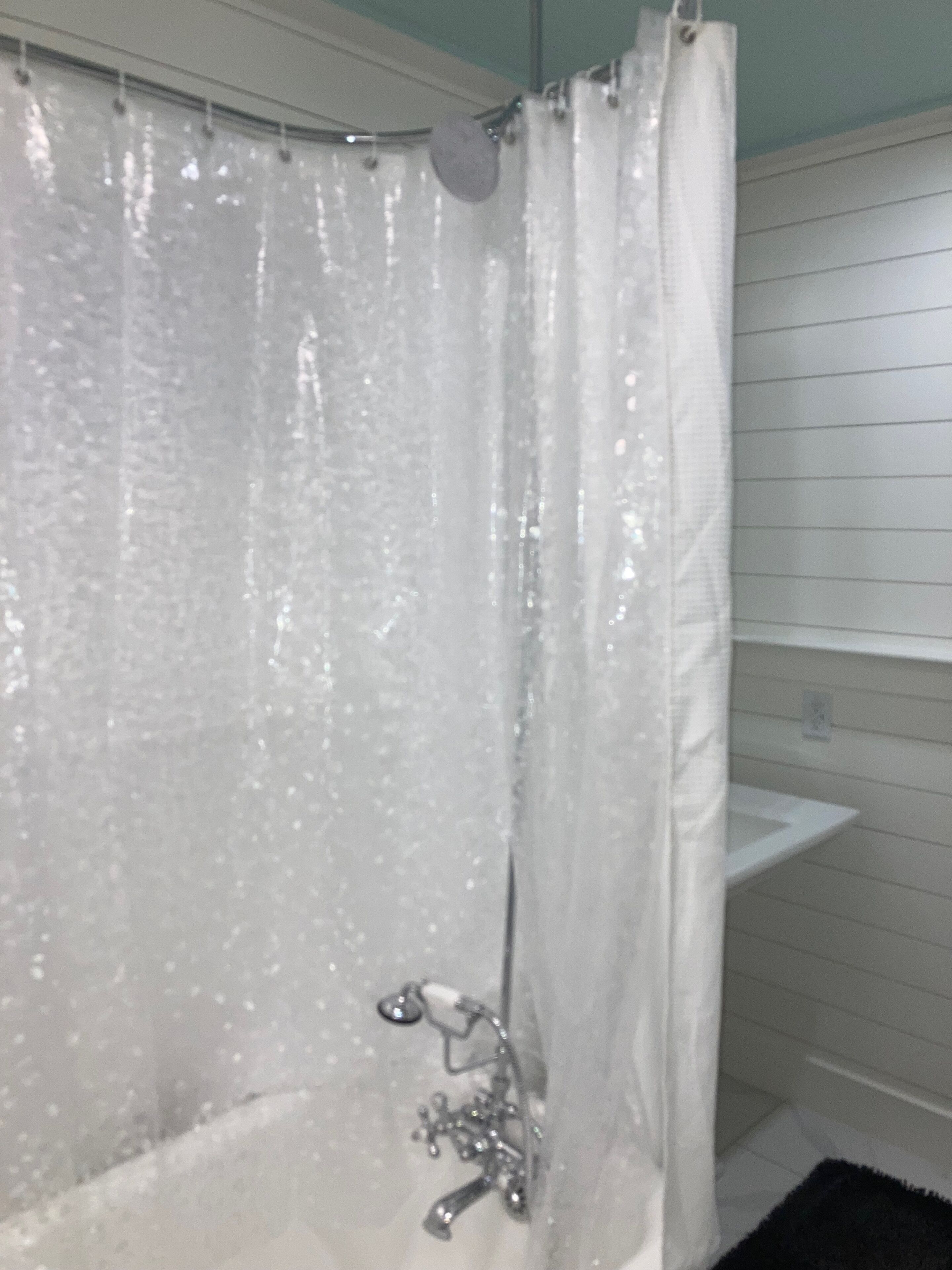 Combined shower/bathtub, hair dryer, towels, toilet paper