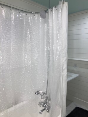 Combined shower/tub, hair dryer, towels, toilet paper
