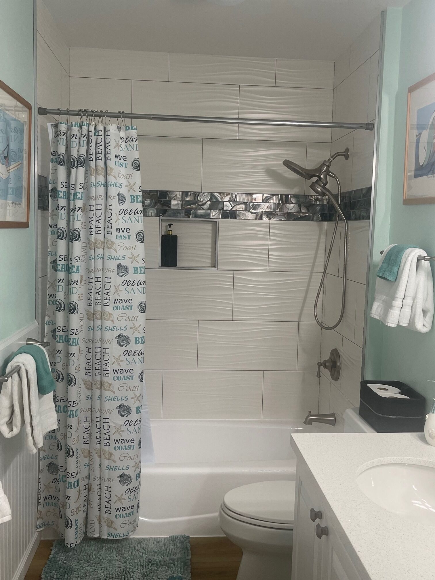 Combined shower/tub, hair dryer, towels, soap
