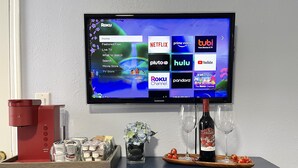 A television displaying a Roku interface with various streaming services. - Newly Renovated Private Master Suite-10MIN to Golden Gate Park. (San Francisco)