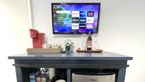 A kitchen area with a built-in refrigerator, microwave, and a shelf with food items. - Newly Renovated Private Master Suite-10MIN to Golden Gate Park. (San Francisco)