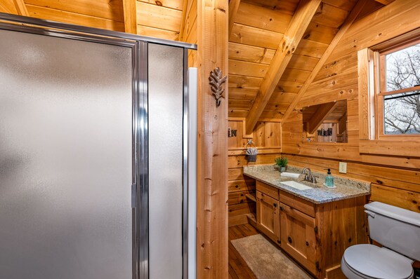 A wooden cabin interior with a kitchen area including a refrigerator, sink, and countertop. - ⛰Smoky Mountain Top View🌲King Suite🌲3 LVL Deck🌲Hot Tub🌲Fire Pit🌲Pool Table⛰ (Sevierville)