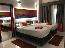 Family Room | Minibar, in-room safe, blackout drapes, iron/ironing board