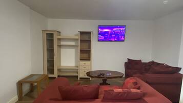 Apartment | Living room | 30-inch TV with cable channels