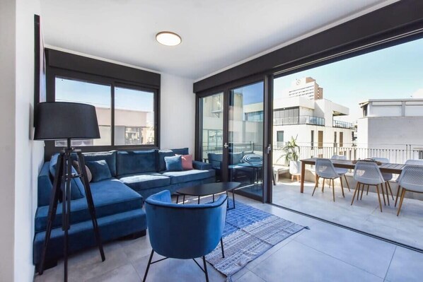 TV, fireplace - Bright Apartment w/ Outdoor Space by HolyGuest (Tel Aviv-Yafo)