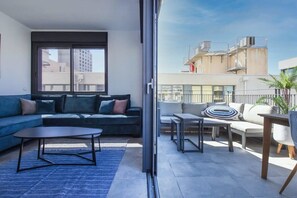 TV, fireplace - Bright Apartment w/  Outdoor Space by HolyGuest (Tel Aviv-Yafo)