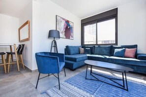 TV, fireplace - Bright Apartment w/ Outdoor Space by HolyGuest (Tel Aviv-Yafo)