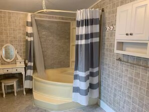 Combined shower/tub, hair dryer, towels, soap