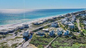 A coastal residential area with houses, a beach, and a clear view of the ocean. - Just Peachy - 4 BR/3BA Private Pool (Santa Rosa Beach)