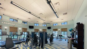 A gym with treadmills, weight machines, and exercise balls. - LUXURY RESORT & GOLF CONDO MIN CLOSE TO DISNEY (Four Corners)