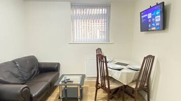 Apartment | Living room | 30-inch TV with cable channels